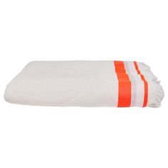 an orange and white towel on a white background