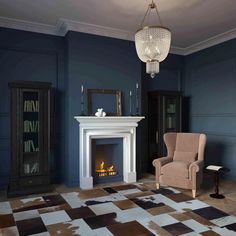 a living room filled with furniture and a fire place