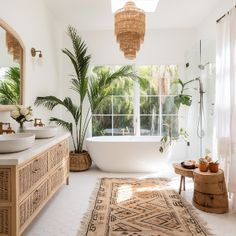 a bathroom with a rug, sink and bathtub next to a window in the room