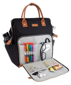 an open bag with pens, scissors and other items in the back pocket on a white background