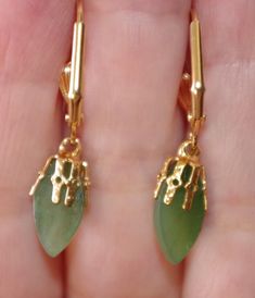 Petite size tear drop green jade lever back earrings diameter of jade drops in largest area : 7 mm from top to bottom including ear wires 34 mm i have few pairs. unless you ask for photos of exact pair, i will pick a random matched pair. vintage 1950 cabs see photos. gorgeous coloring on these carved undyed green jades very cool looking. you will love wearing it. Green Drop Earrings, Pierced, Green Pierced Drop Earrings, Green Drop Teardrop Earrings For Formal, Green Teardrop Earrings For Formal Occasions, Formal Green Teardrop Drop Earrings, Green Pierced Teardrop Dangle Earrings, Green Teardrop Dangle Earrings, Green Clip-on Dangle Earrings, Green Clip-on Dangle Jewelry