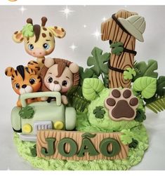 there is a cake that has animals on it