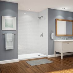 a bathroom with blue walls and wood floors