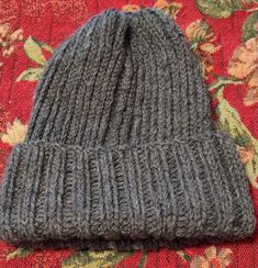 Ready to ship. A new hand knit beanie made from 100% wool. This hat measures 7 1/2 inches wide,  ,10 inches tall without the cuff  rolled up, 8 inches tall with the cuff rolled and stretches to ten inches wide. This is a warm and snug beanie that you can wear outside in the cold weather and not worry about being chilled. Gray Knit Winter Hat, Gray Knit Beanie Hat, Gray Knit Beanie, Warm Knit Gray Beanie, Warm Gray Knit Beanie, Gray Soft Knit Hat, Gray Knitted Beanie For Fall, Gray Soft Knit Beanie One Size, Gray Beanie For Cold Weather In Fall