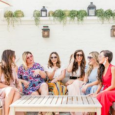 a group of women sitting next to each other