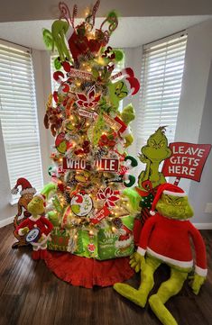 the grinch christmas tree has been decorated with candy canes and other holiday decorations