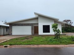 Roof, roof line fascia and Roller door: Colorbond Surfmist
Front gabbles: Colorbond Dune
Exterior walls: Pebble Bay quarter Taubmans Concrete Fence Wall, Roof Ideas, Roof House, Concrete Fence, Fence Wall