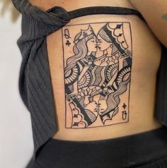 a woman with a tattoo on her stomach has a queen of hearts in the middle