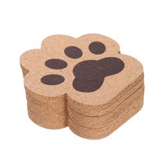 four coasters with paw prints on them, one is brown and the other is black