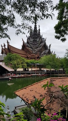 a large building sitting next to a body of water