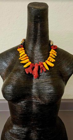 Raw and rough red branch corals are the focal point in this lightweight and comfortable statement necklace for either men or women. Each coral is spaced with a tiny red coral. Vibrant and hot orange corals comprise the bulk of the necklace with red coral oval beads separating the front fromt he back. Funky artisan hand painted glass tube beads from Africa complete the back. Adjusts from 18-21" with gold tone hardware, a tiny lobster claw clasp and a 3" extender chain complete the piece. OOAK Wea Unique Orange Red Coral Necklace, Orange Branch, Petite Woman, Hot Orange, Oval Beads, Coral Necklace, Painted Glass, Petite Women, Tube Beads