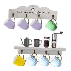 coffee mugs hanging from hooks on a shelf with the words life happens, coffee helps