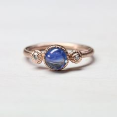 Blue Cabochon Sapphire Ring In Fine Jewelry Style, Fine Jewelry Blue Cabochon Sapphire Ring, Blue Cabochon Sapphire Ring, Round Sapphire Jewelry With Rose Cut Diamonds, Wedding Sapphire Jewelry With Cabochon, Blue Sapphire Cabochon Jewelry, Blue Cabochon Sapphire Ring In 14k Gold, Round Sapphire Jewelry With Cabochon, Cabochon Sapphire Ring