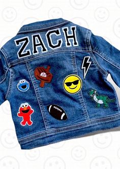 This custom denim jacket makes the perfect gift for kids of all ages.   From a new baby gift, to first birthday outfit, to a totally awesome jacket to wear to school. Name or monogram  is always included.  Please choose letter type & # of patches in addition to name.  We have so many patches to choose from (not just the samples shown in photos).  Please let us know any favorites / must haves for the kids (colors, hobbies, etc).  This jacket should be as unique and special as the kid wearing it!  Please specify if you would like a preview before patches are secured. This may delay shipping and processing. We promise to be timely in our responses and request that you do the same. Patches are first applied with heat and then machine sewn on for longevity.  However, jacket should always be was Patch Jean Jacket, Boys Jean Jacket, Custom Jean, Toddler Boy Jeans, Jean Jacket Patches, Custom Jean Jacket, Custom Denim Jacket, Toddler Christmas Gifts, Patch Jacket