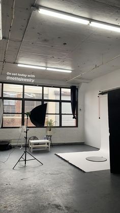 an empty studio with lights and lighting equipment