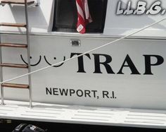 there is a ladder on the side of a boat that says trap newport, r i