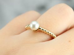 The perfect gift for a Sweet Sixteen or a June Birthday, this simple solitaire would look well stacked with other rings or bands, as well. Versatile and lovely, this will be a perfect wardrobe basic for years to come. Metal: 14K Yellow Gold Gem: Pearl Gem Measurements: 5.7 mm, Round Ring Size: 5.75 Marks: "14KT" Stamped on the inside band Fine Jewelry Stackable Pearl Ring With Round Band, Yellow Gold Stackable Pearl Ring For Anniversary, Elegant Stackable Yellow Gold Pearl Ring, Elegant Yellow Gold Stackable Pearl Ring, Elegant 14k Gold Stackable Pearl Ring, Elegant Stackable Pearl Ring In Yellow Gold, Classic 14k Gold Stackable Pearl Ring, Stackable 14k Gold Pearl Ring With Round Band, Stackable White Gold Pearl Ring With Round Band