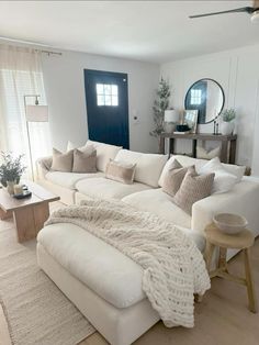 a large white couch sitting in a living room