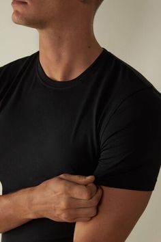 Short sleeve crewneck T-shirt in stretch Supima® cotton. The fiber of the highest quality, incredibly soft and breathable, it features optimal elasticity. The structure of the fabric guarantees excellent durability from washing. A simple and comfortable piece. Seamless Stretch Crew Neck T-shirt, Seamless Crew Neck T-shirt With Comfort Fit, Casual Black Seamless T-shirt, Crew Neck Top With Minimal Stretch, Classic Stretch Crew Neck T-shirt, Seamless Crew Neck T-shirt For Loungewear, Casual Fitted Tops With Soft Touch, Everyday Seamless Crew Neck T-shirt, Solid Crew Neck Tops With Soft Stretch