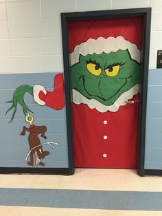 two doors decorated to look like the grin's head and person with green hair