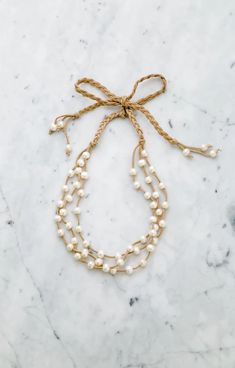 Triple strands Pearl & Leather Ribbon Necklace is Stephanos' signature necklace we all love. Timeless pearl necklace in style accomplishes your casual outfit and party dress. This beautiful day to night necklace is carefully hand-crafted with the quality pearl and love. #pearl #pearllover #triplepearls #bride #bridal #bridalshower #gift #handmade Knotted Pearl Necklace, Night Necklace, Handmade Pearl Necklace, Leather Pearl Necklace, Signature Necklace, Ribbon Necklace, Jewelry Website, Simple Outfit, Pearl Leather