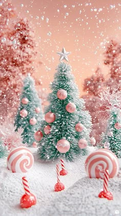 christmas trees with candy canes and candies in the snow on a pink background