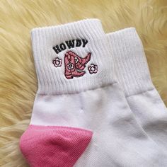 "Howdy Cowgirl Socks - Calling all cowgirls! Our new embroidered athletic socks are so fun!  Our Howdy Cowgirl Boot style features the cutest pink cowgirl boot, \"howdy\" & cute little flowers against a white sock w/ pink trim.  Perfect for adding cowgirl vibes to your feet (even when you can't wear your boots  Soft & cozy, our socks are made of 95% cotton & 5% spandex.  Perfect for wearing with your sneakers!  ♥ Size: Women's one-size fits most ♥ Materials: cozy & soft 95% cotton & 5% spandex ♥ Cute White Socks With Letter Print, Cowgirl Socks, Pink Cowgirl Boot, Cowgirl Vibes, Pink Cowgirl Boots, Embroidered Socks, Socks Womens, Pink Cowgirl, Cowgirl Boot