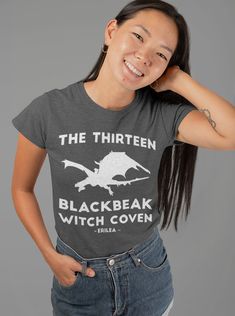 "Love ToG? Get our \"The Thirteen Blackbeak Witch Coven\" t-shirt. Available in Black, Dark Grey Heather, Red and White. ABOUT THE T-SHIRT This super-soft, baby-knit t-shirt looks great on both men and women. It is an updated unisex tee, which fits like a well-loved favorite. Made from 100% cotton. Still have doubts? Check out this product video: https://vimeo.com/161530175 ► Unisex \"Boyfriend\" T-Shirt ► 100% combed and ring-spun cotton ► Baby-knit jersey ► 4.2 oz. fabric weight ► Shoulder-to- Black Fandom T-shirt For Halloween, Asterin Blackbeak, Manon Blackbeak, The Thirteen, Witch Coven, Witches Halloween, Heather Green, Product Video, Heather White