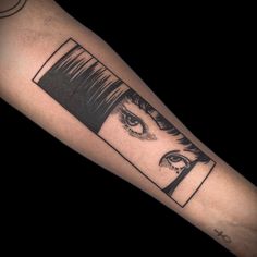 a woman's arm with an eye and eyelashes tattoo on the left inner forearm