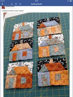 four blocks are laid out on the table to be made into quilted coasters