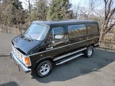 a black van parked on the side of a road