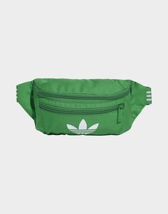 Whether your next journey takes you near or far, keep essentials close at hand in this signature adidas Adicolor waist bag. With its easy-access zip closure, adjustable waist strap and bonus front pocket, this versatile bag is perfect for long adventures and quick day trips alike. Its soft plain weave build is lightweight, breathable and made to last. An iconic Trefoil logo rounds out the look with an extra dose of adidas pride.Made with a series of recycled materials, and at least 40% recycled content, this product represents just one of adidas' solutions to help end plastic waste.• Dimensions: 9.5 cm x 32.75 cm x 15 cm• 100% polyester (recycled)• Polyester lining• Top zip closure• Front zip pocket• Adjustable waist strap Adidas Adicolor, Green Adidas, Round Logo, Waist Strap, Bum Bag, Jd Sports, Waist Bag, Day Trips, Adidas Originals