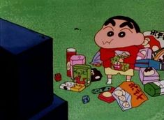 a cartoon character sitting on the ground surrounded by boxes and other things in front of him