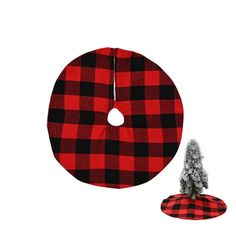 a red and black plaid christmas tree skirt next to a small white pine ornament