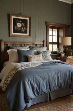 a large bed sitting in a bedroom next to a window