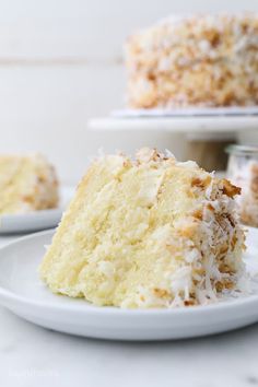 a close up of a slice of cake on a plate with another piece in the background