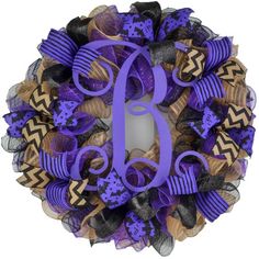 a purple and black wreath with the letter d on it