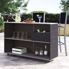 an outdoor bar cart with drinks on it