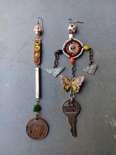 two key chains with charms attached to them