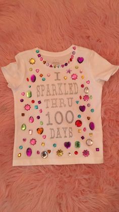 a white t - shirt that says i sparkled through 100 days on the front