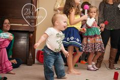 a group of children playing with toys in a living room