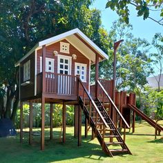 there is a small house with stairs leading up to the roof and on top of it