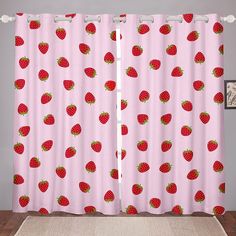 a pink curtain with strawberries on it