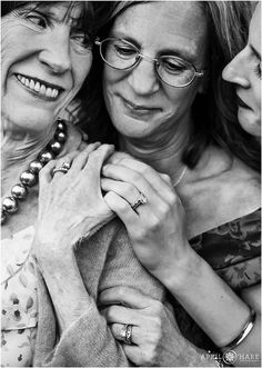 two women are holding each other and smiling