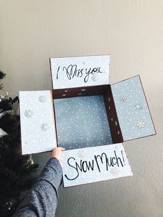 someone is holding up some cards to show off their snow much design on the christmas tree