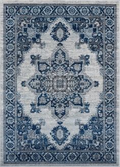 a blue and white rug with an ornate design