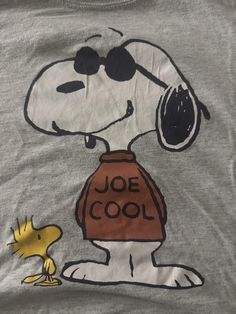 a shirt with a cartoon character on it and a dog in the front that says'joe cool '