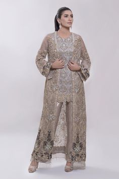 Pakistani Organza Jacket with Pant for Party with Magnificent Look emblazoned with beautiful embroidery, dabka and sequins. This lehnga is unique in style and have classy look and perfect choice for traditional bride. Jacket: Long open style jacket for party dress in gray color is embellished with fully copper color embroidery, dabka, nakshi, stones, cutdana, crystals work. Neckline is decor with embroidery and with full length sleeves. Fabric used for jacket is chiffon with silk inner. Pant: St Latest Pakistani Dress Designs 2020, Net Dresses Pakistani Style, Kebaya With Pants, New Party Wear Dress, Net Dresses, Eastern Wear, Organza Jacket, Dresses Pakistani, Pakistani Party Wear Dresses