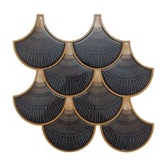 six black and gold fan shaped trays on a white background