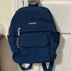 New Without Tags! Beautiful Blue Color. Has 2 Side Pockets, 2 Exterior Pockets In The Front. The Inside Has Slots For Phone. The Back Zippered Pouch Is A Built In Wallet Which Is Rfid Safe! Light Pink Backpack, Baggallini Bags, Camo Backpack, Free People Bags, Laptop Travel, Red Backpack, Canvas Purse, Gray Camo, Asics Running Shoes